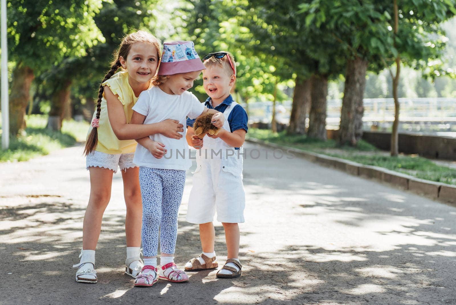 Lovely cute kids playing in the park a beautiful summer sunny day.