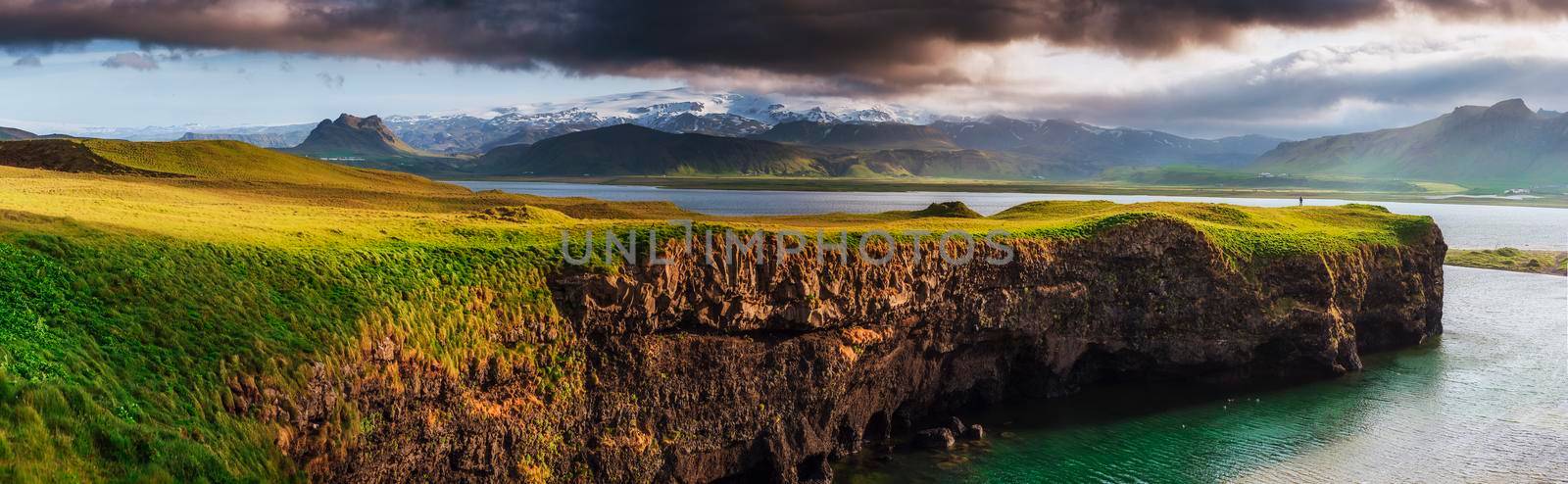 Reynisfjara black sand beach in Iceland. Reynisfyal Mountains.