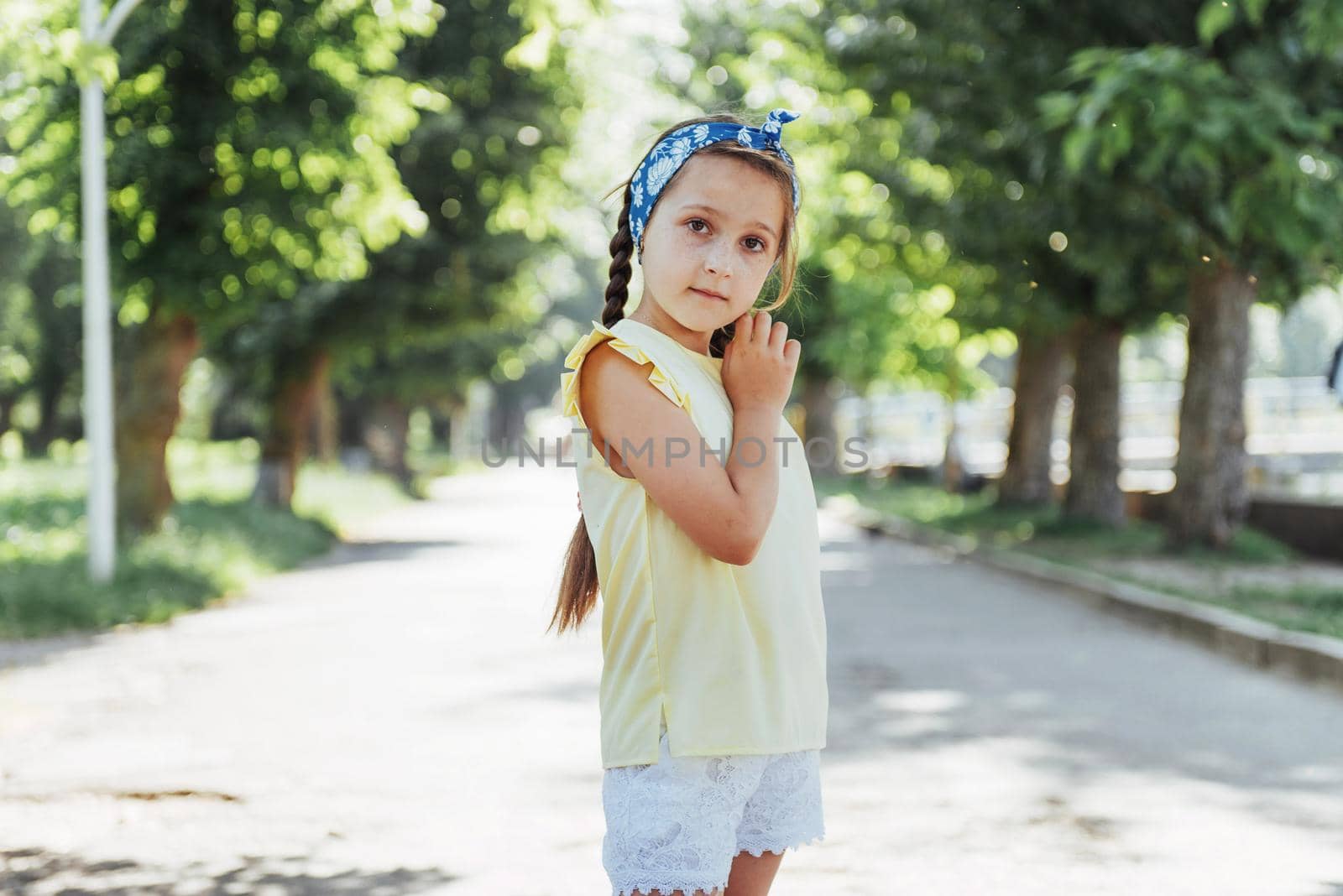 Beautiful girl in a summer sunny day.