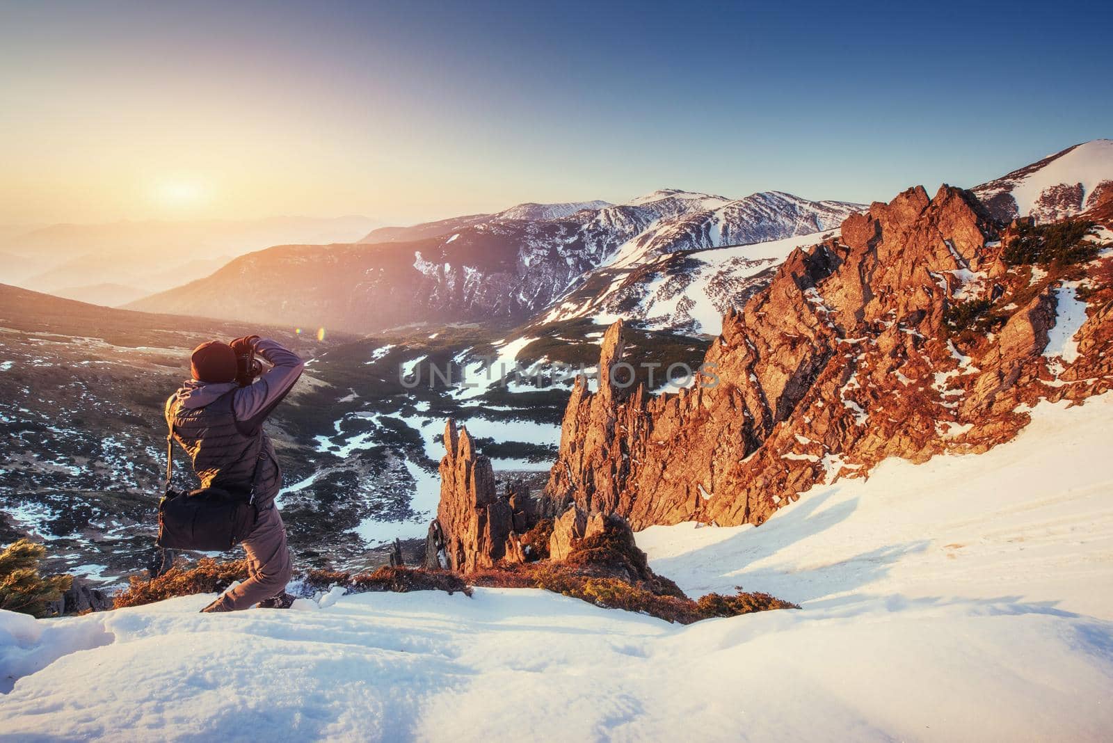 tourist looks at the landscape. Beautiful sunset. Spring landscape. Carpathians Ukraine Europe