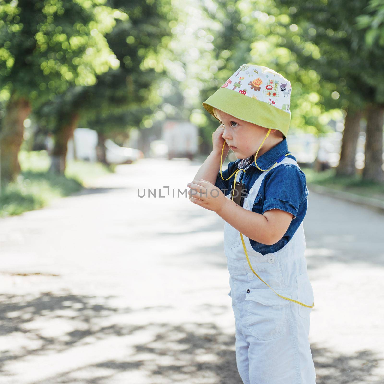 Cute boy posing for photo outdoors. Ukraine. Europe