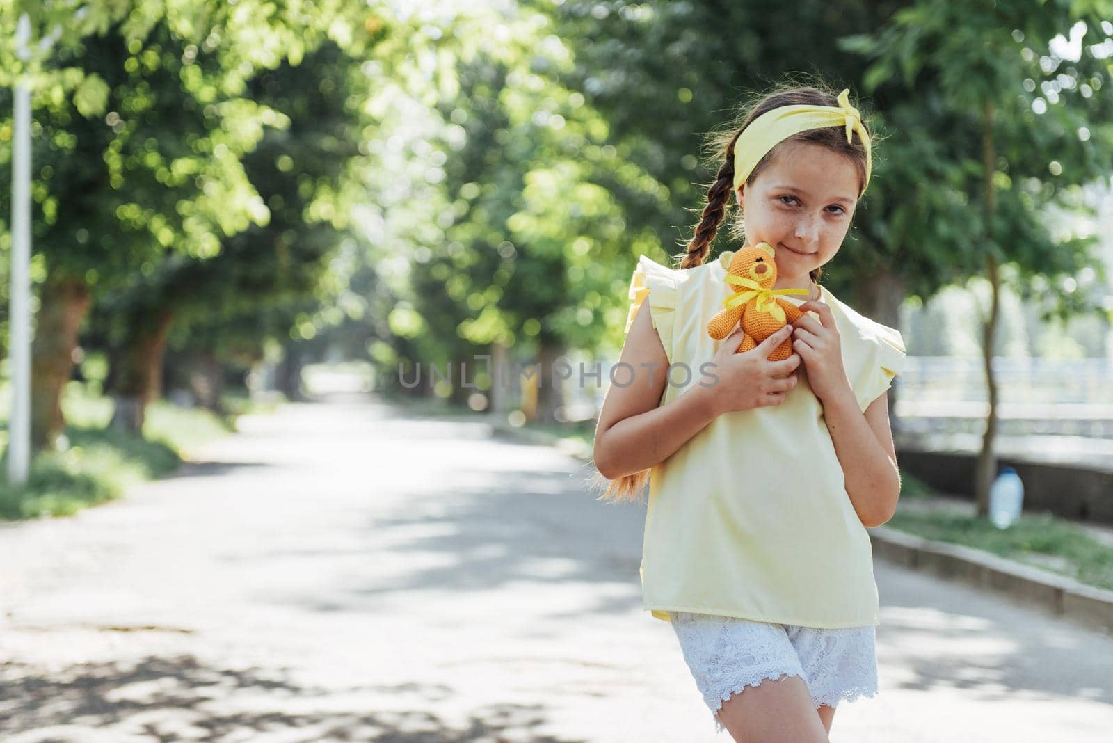Beautiful girl in a summer sunny day.