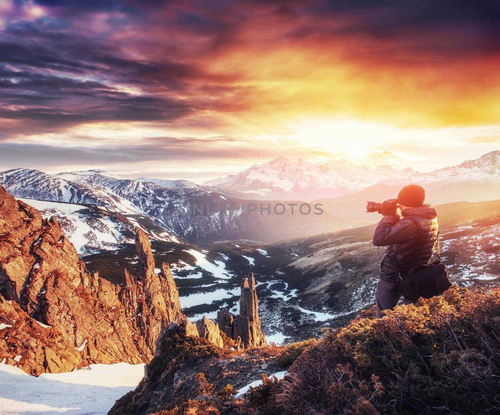 A tourist looks at the landscape. Beautiful sunset. Carpathians, Ukraine, Europe