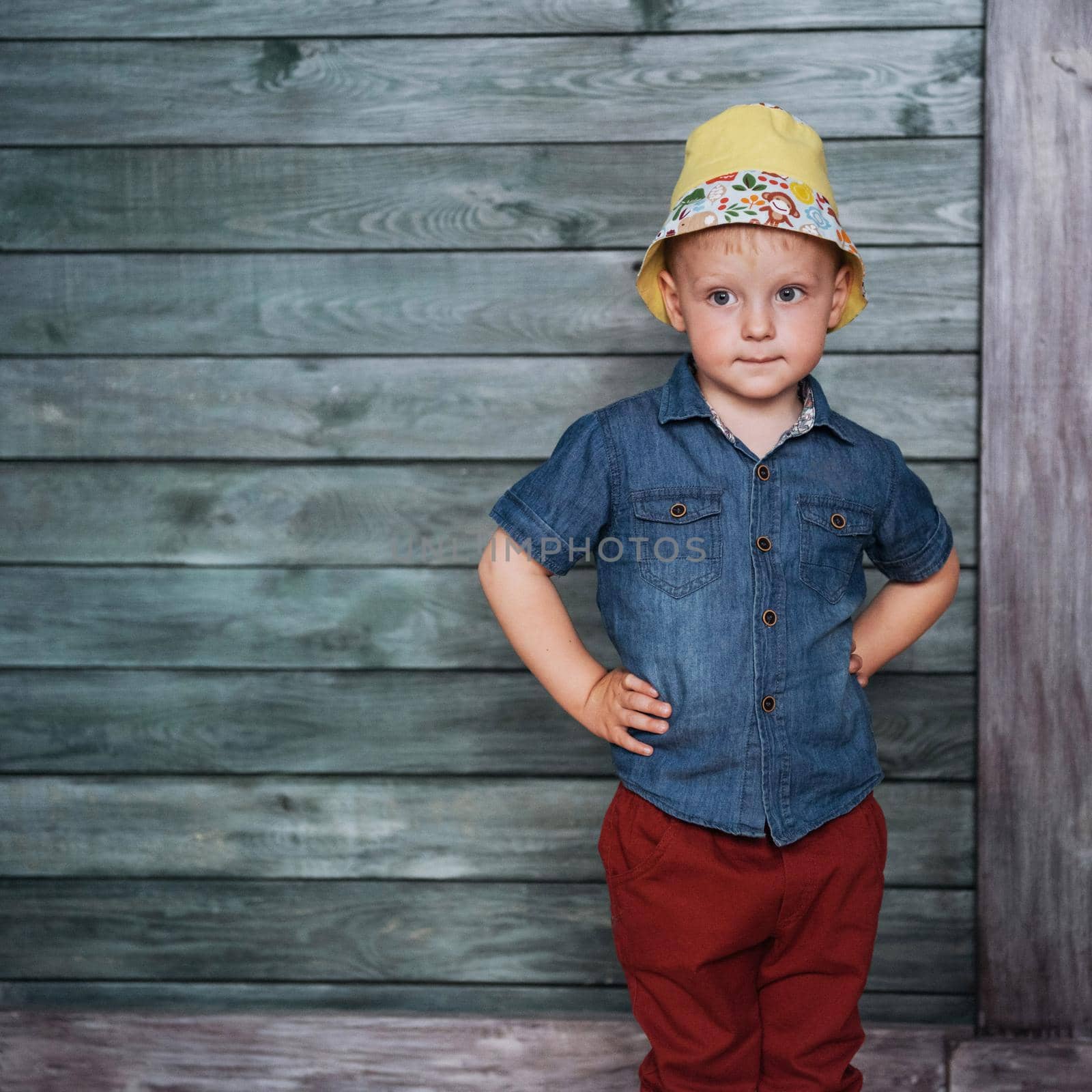 Happy little boy, child in a Panama hat.