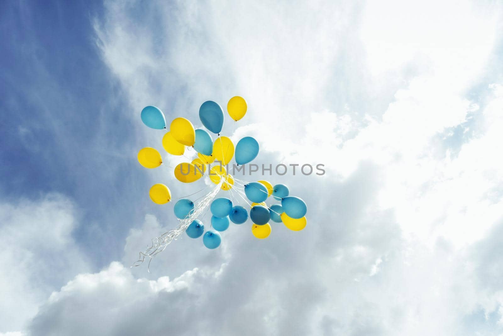 Flying in the sky yellow - blue balls.