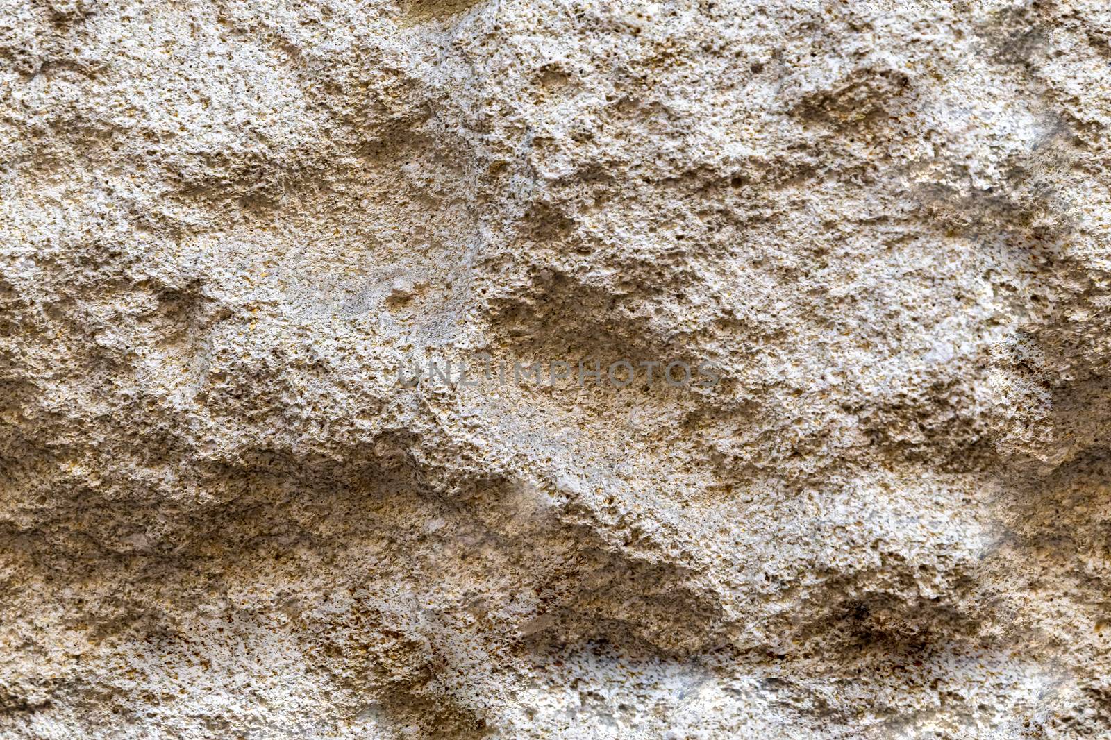 Seamless beige rock stone wall background texture by Elenaphotos21