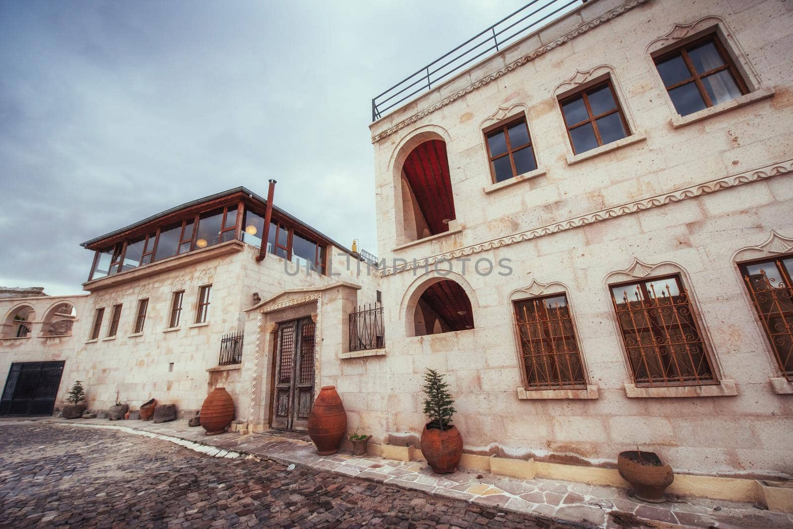 Old traditional Ottoman house in the background.