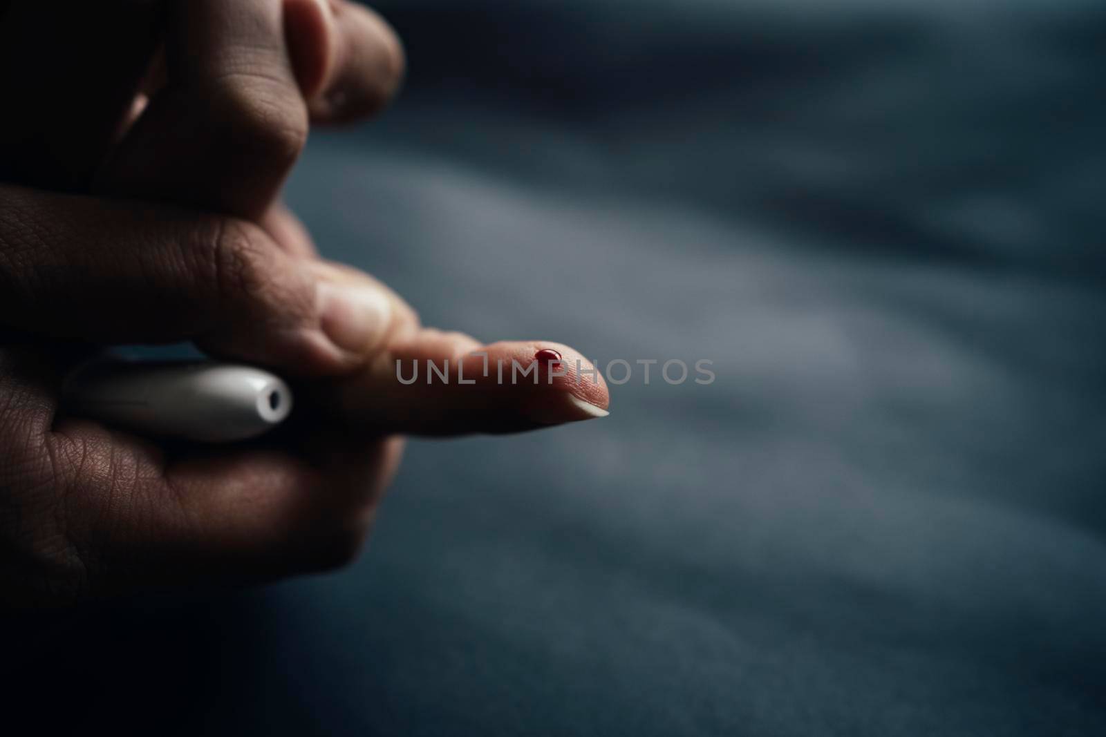 medicine, diabetes, blood glucose, health care and people concept - close up of woman finger with blood drop