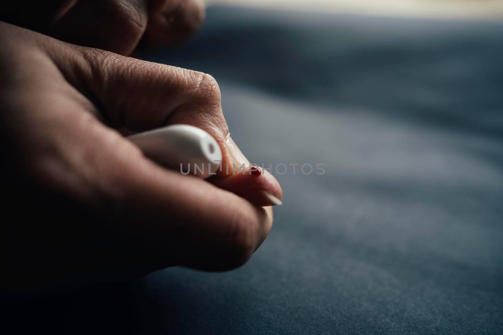 medicine, diabetes, blood glucose, health care and people concept - close up of woman finger with blood drop