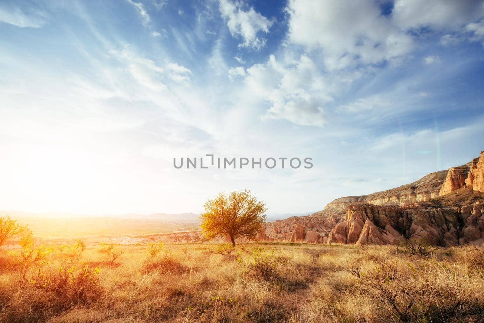 Fantastic sunrise over the Red Valley in Cappadocia, Anatolia, Turkey. Volcanic mountains in Goreme National Park.
