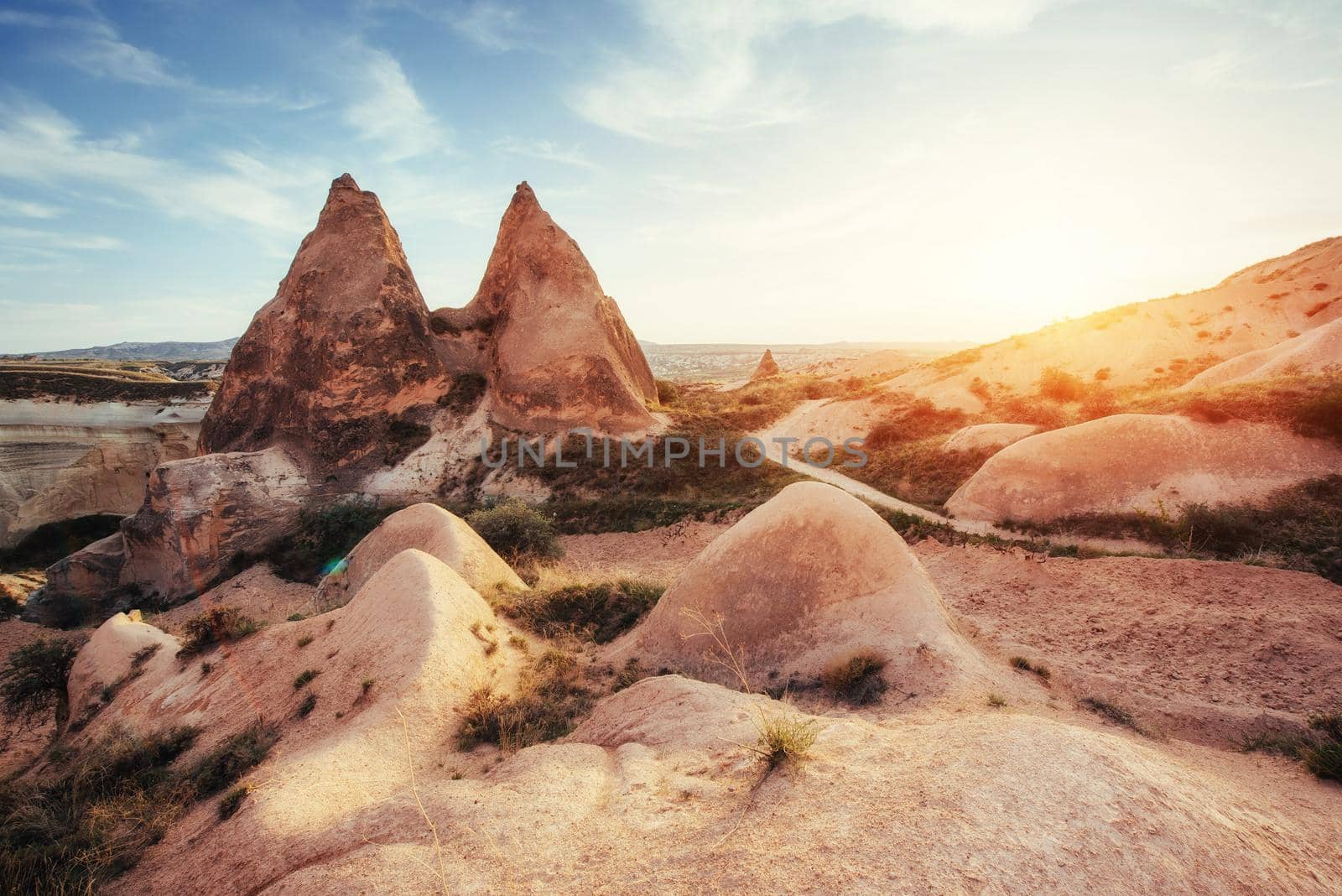 Fantastic sunrise over the Red Valley in Cappadocia, Anatolia, Turkey. Volcanic mountains in Goreme National Park.