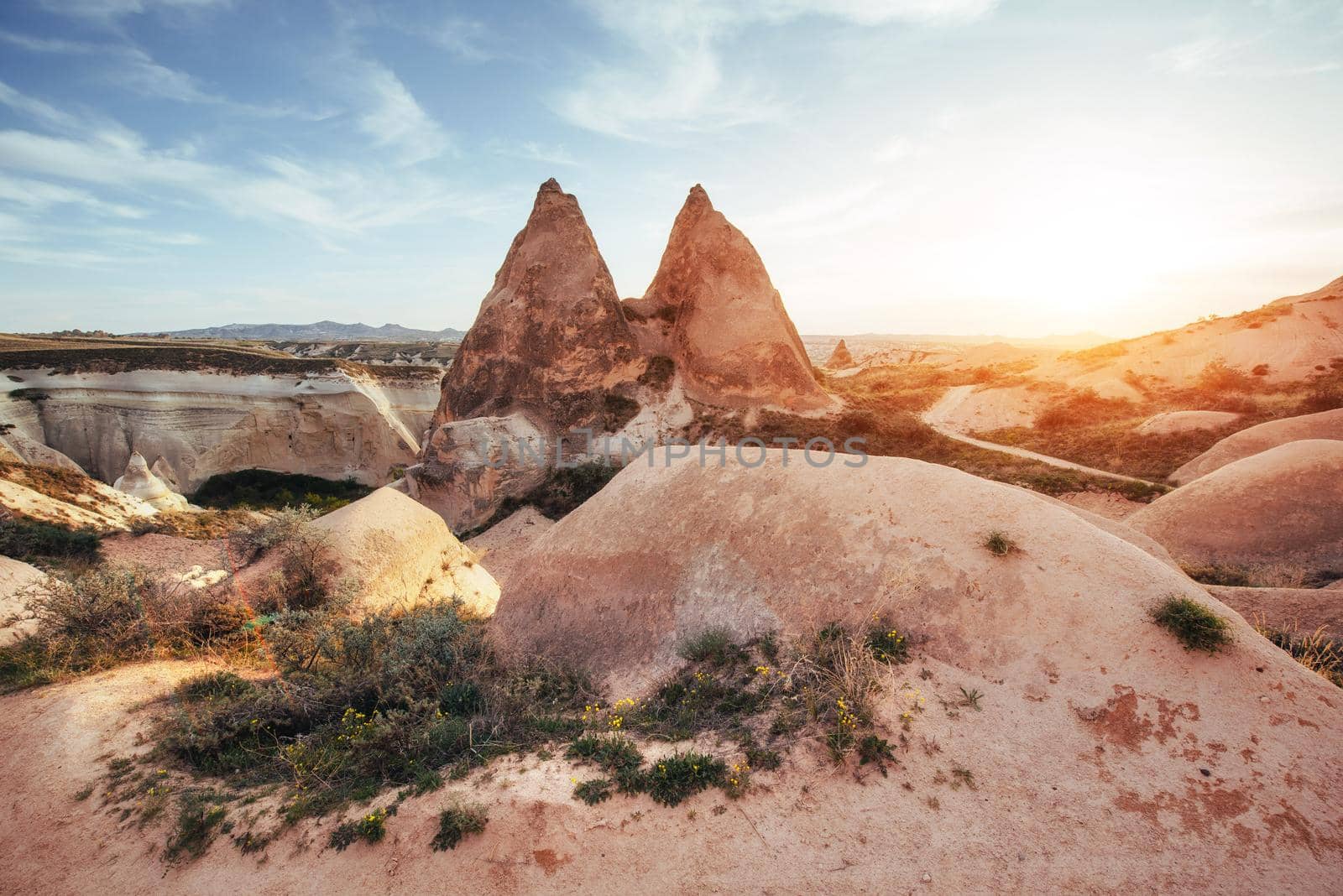 Fantastic sunrise over the Red Valley in Cappadocia, Anatolia, Turkey. Volcanic mountains in Goreme National Park.
