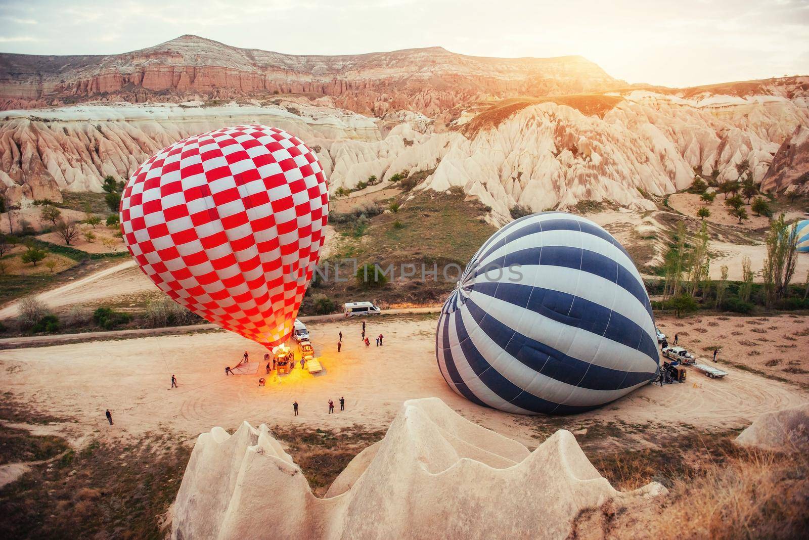 Cappadocia, Turkey. The first crew of flame and heat for inflating the balloon before launch. Balloon is one of the most famous of that trip will have to do in Cappadocia