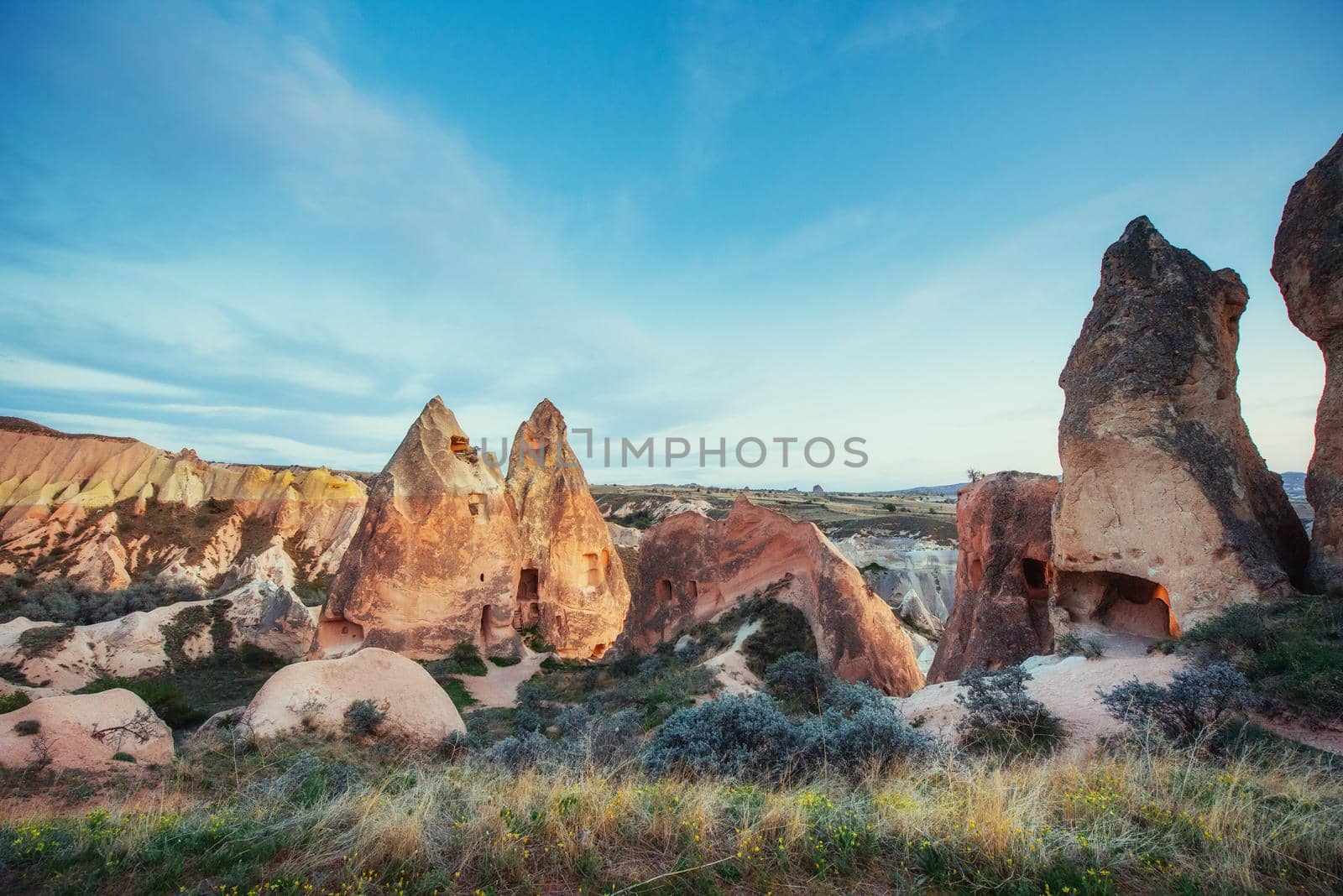 Review unique geological formations in Cappadocia, Turkey. Kappadokiets region, with its valleys, gorges, hills, located between the volcanic mountains in Goreme National Park.