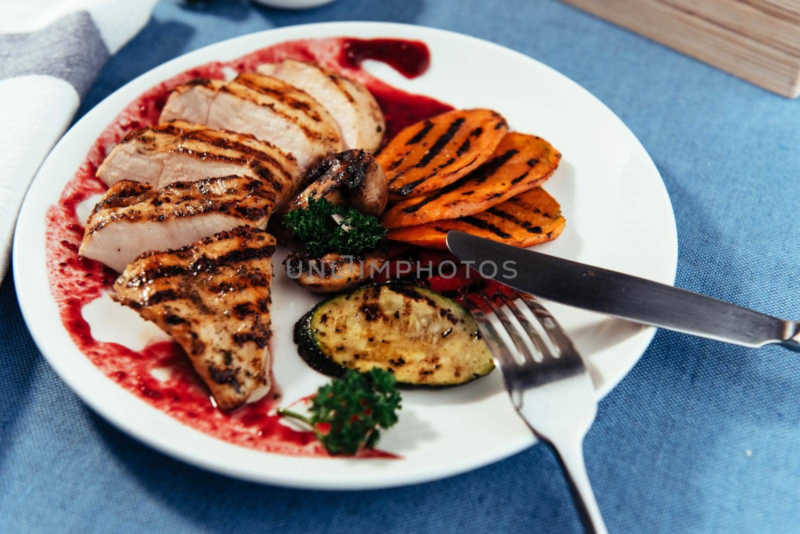 Grilled vegetables and chicken fillet. Traditional cuisine. Grill kitchen.