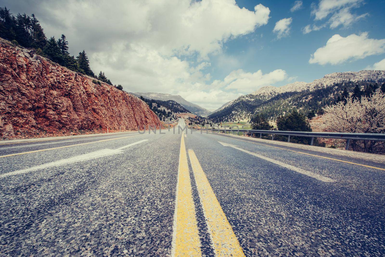 View of a beautiful asphalt road that video to the mountains.