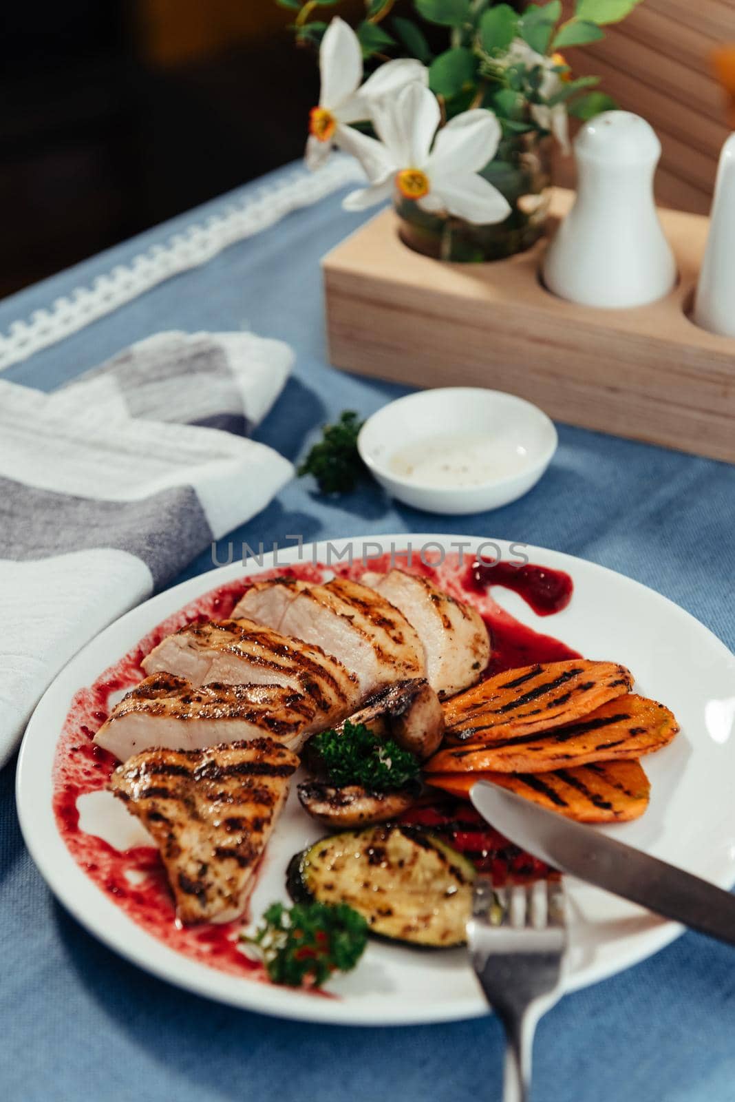 Grilled vegetables and chicken fillet. Traditional cuisine. Grill kitchen.