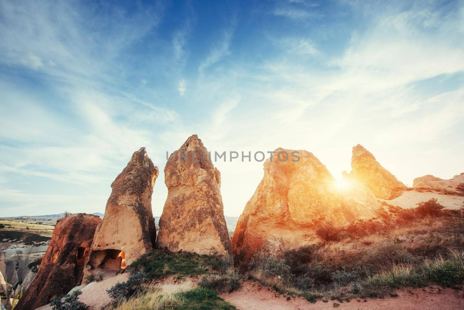 Fantastic sunrise over the Red Valley in Cappadocia, Anatolia, Turkey. Volcanic mountains in Goreme National Park.