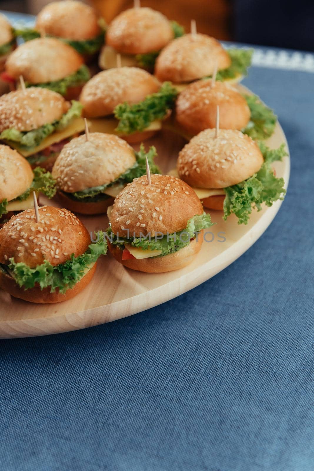 Hamburger on wood table. Home made burger. Fastfood meal. Pub burger. Delicious Hamburger. Gourmet hamburger.
