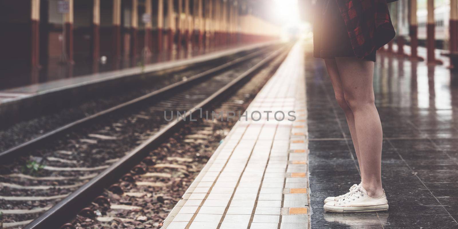 Pretty Young traveler woman planning trip at train station. Summer and travel lifestyle concept. by itchaznong
