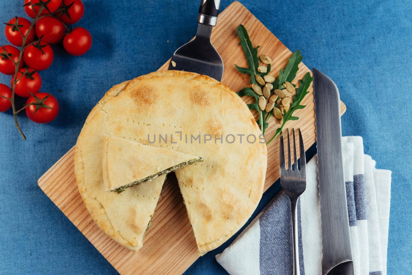 Traditional Greek spinach pie with puff pastry.