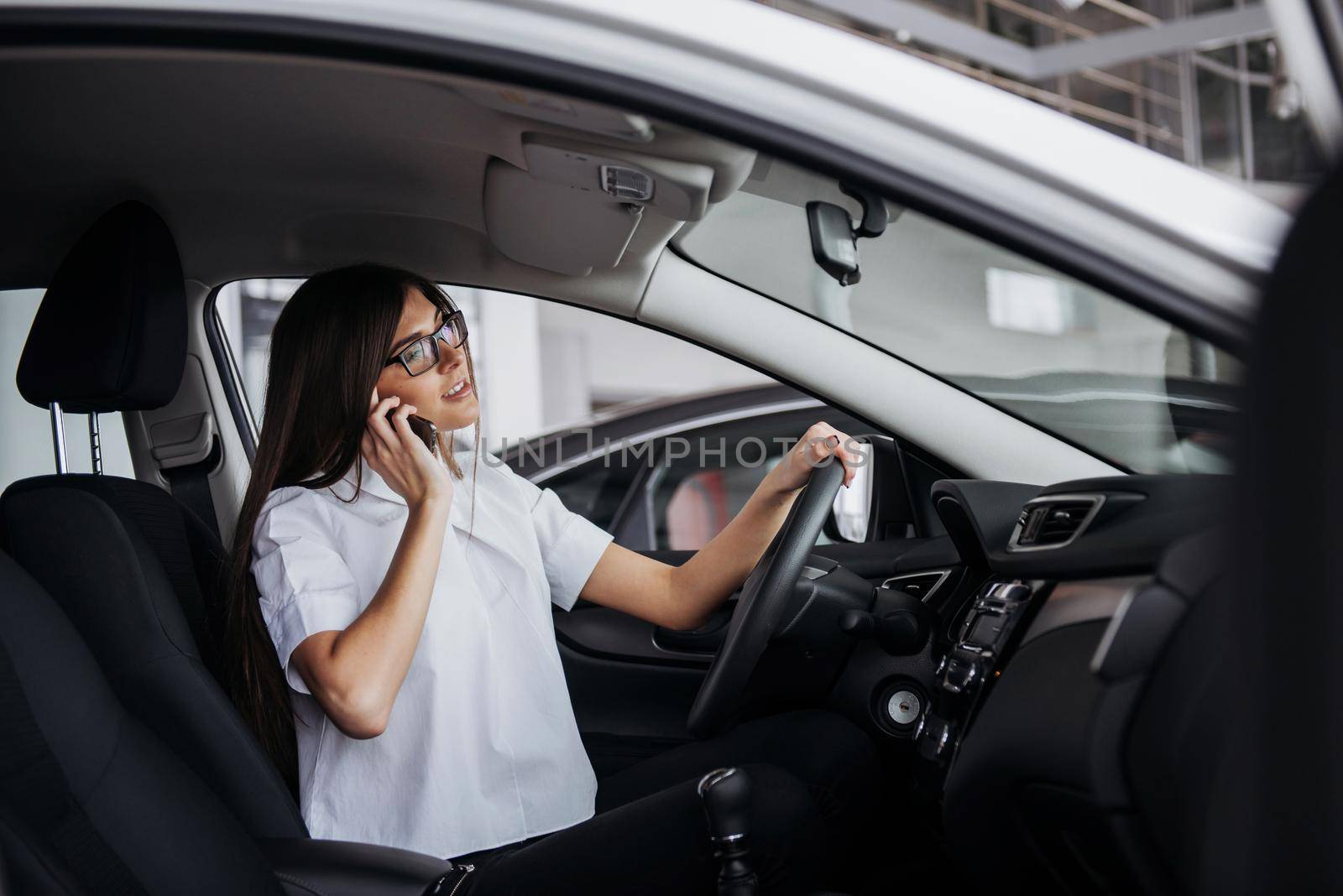 Businesswoman talking on the phone in the car