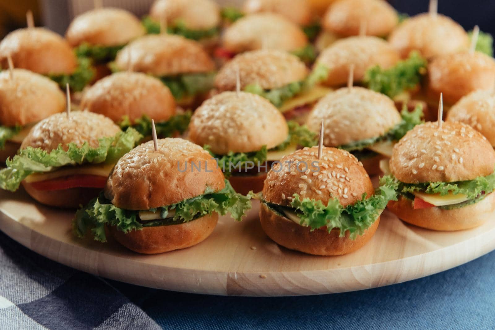 Hamburger on wood table. Home made burger. Fastfood meal. Pub burger. Delicious Hamburger. Gourmet hamburger.