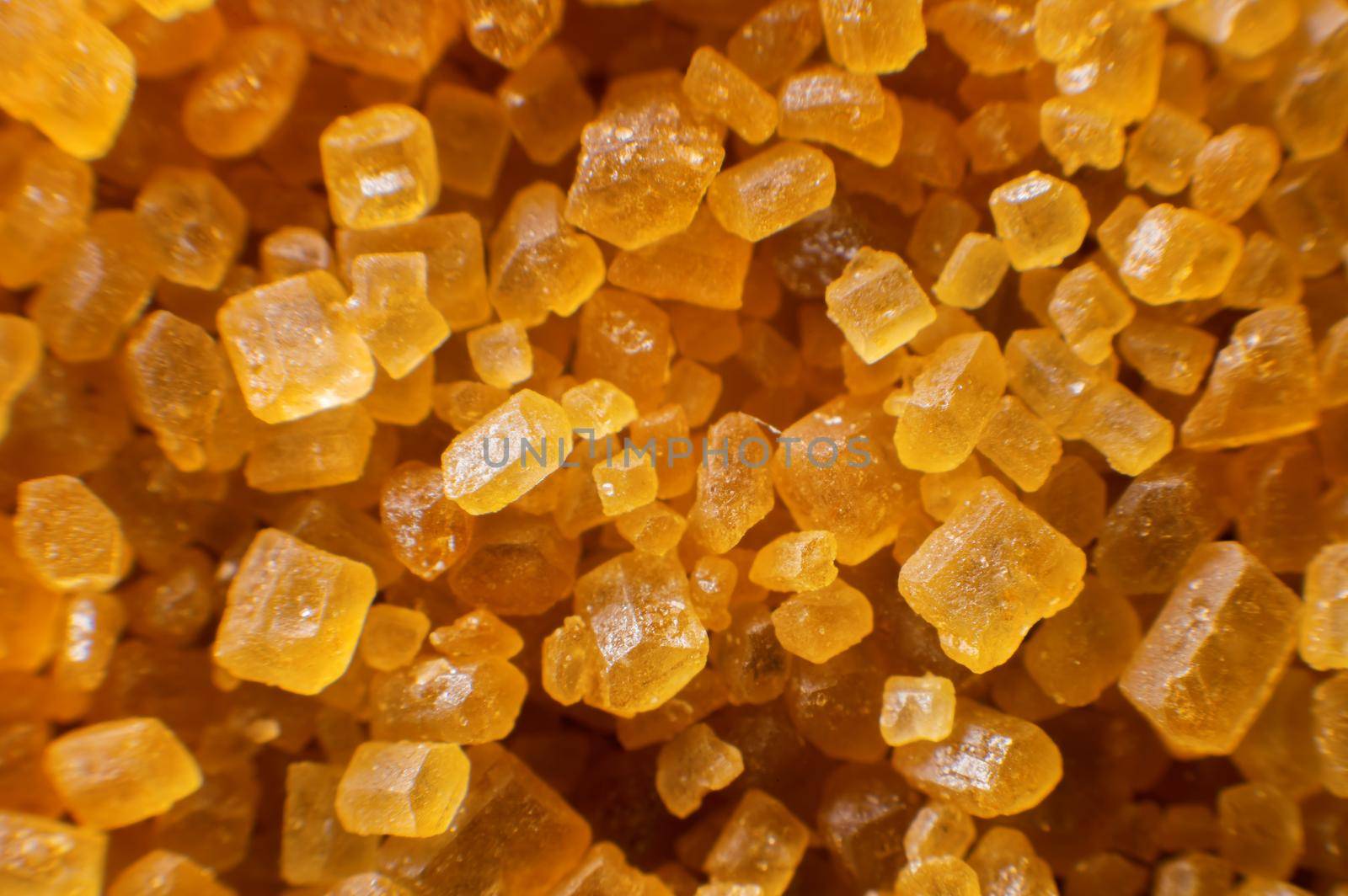 Extreme macro crystals of cane sugar. Abstract sugar background close-up in shallow depth of focus.