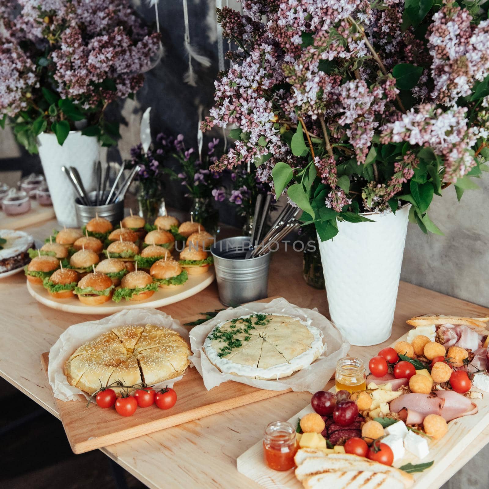 Canapes and drinks a desserts on the buffet table.