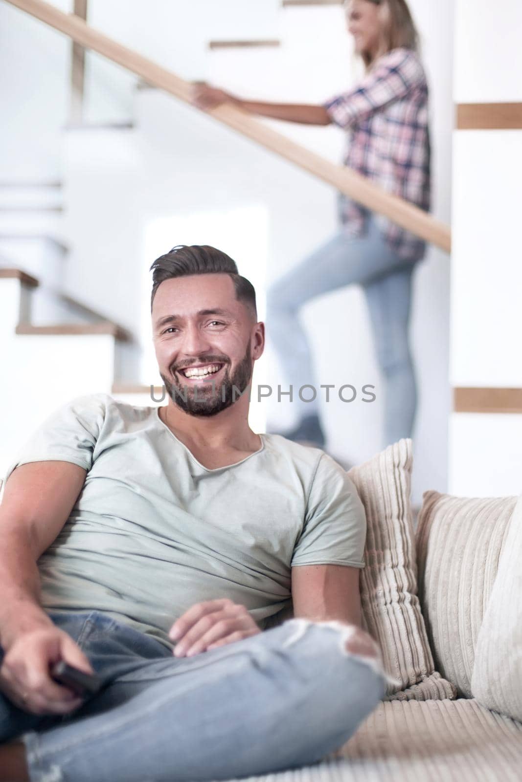 close up. young man sitting on sofa. photo with copy space