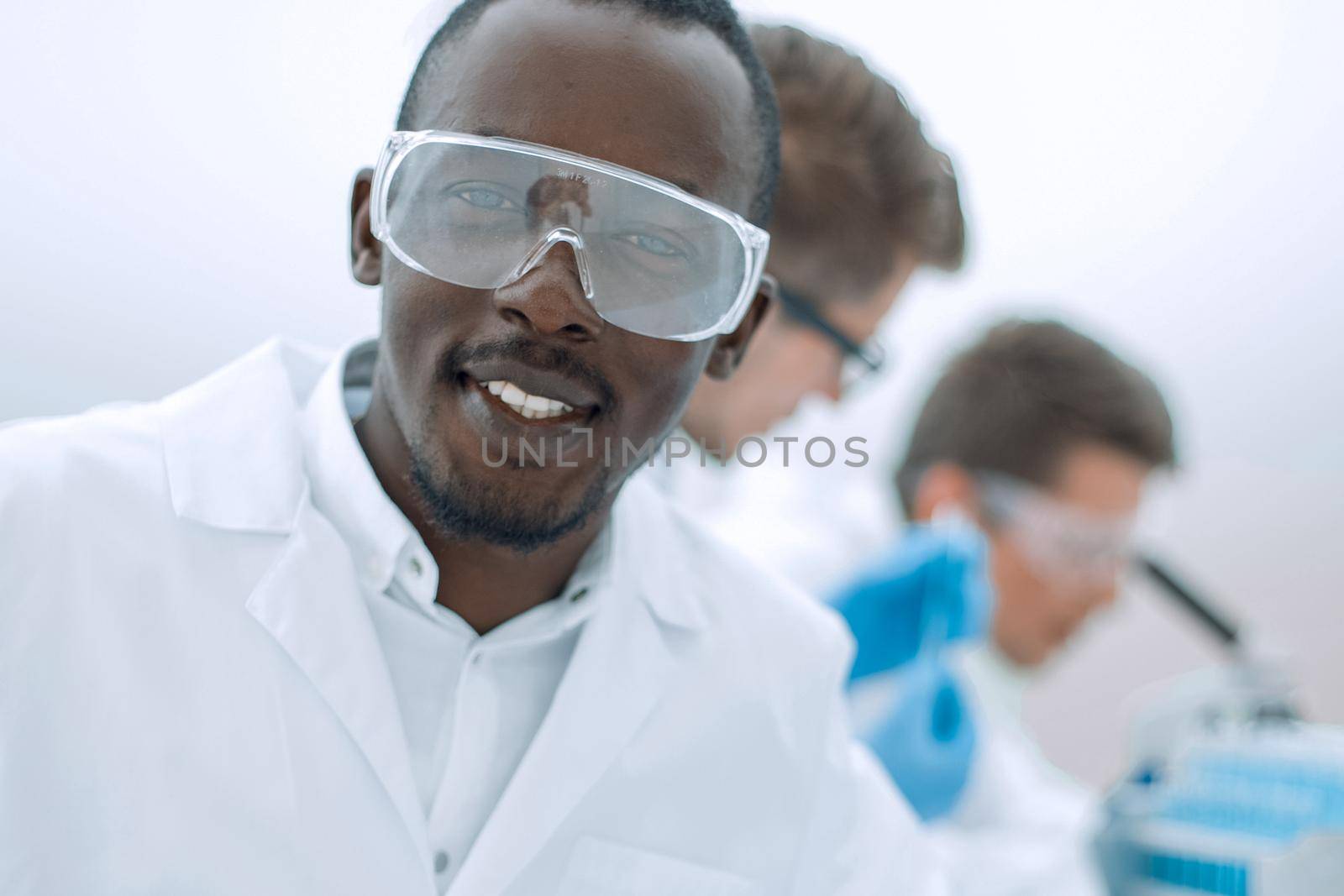 promising scientist on the background of the laboratory.photo with copy space