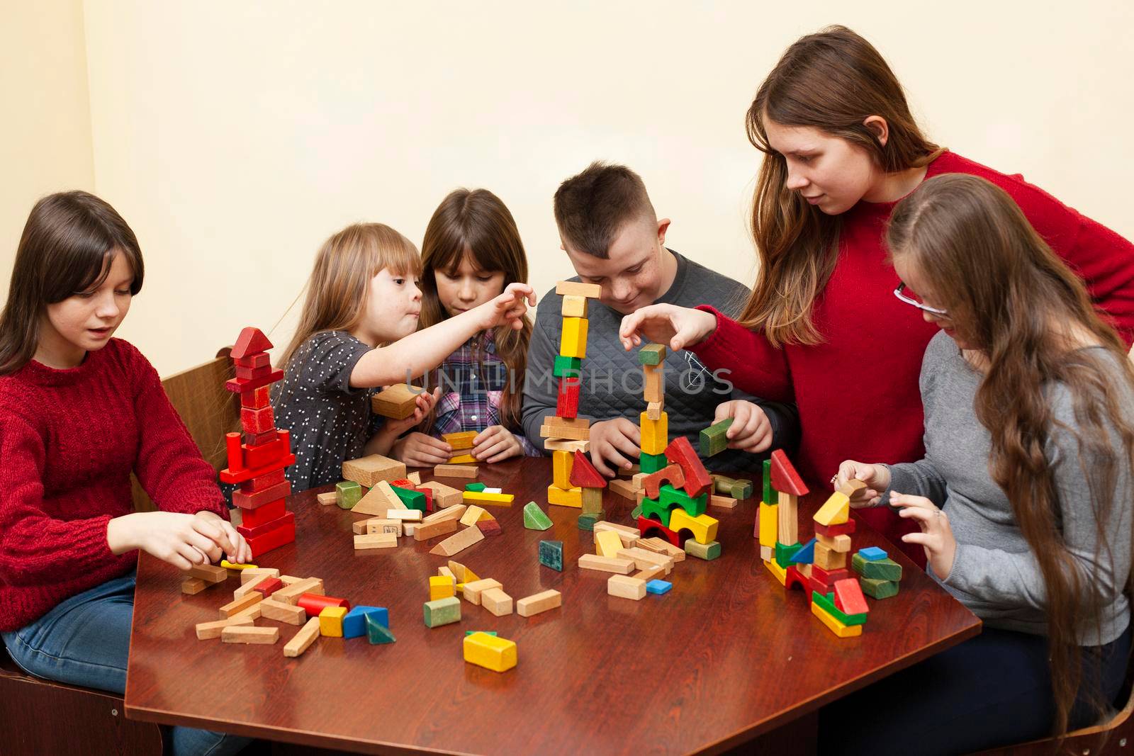 children with down syndrome playing with toys