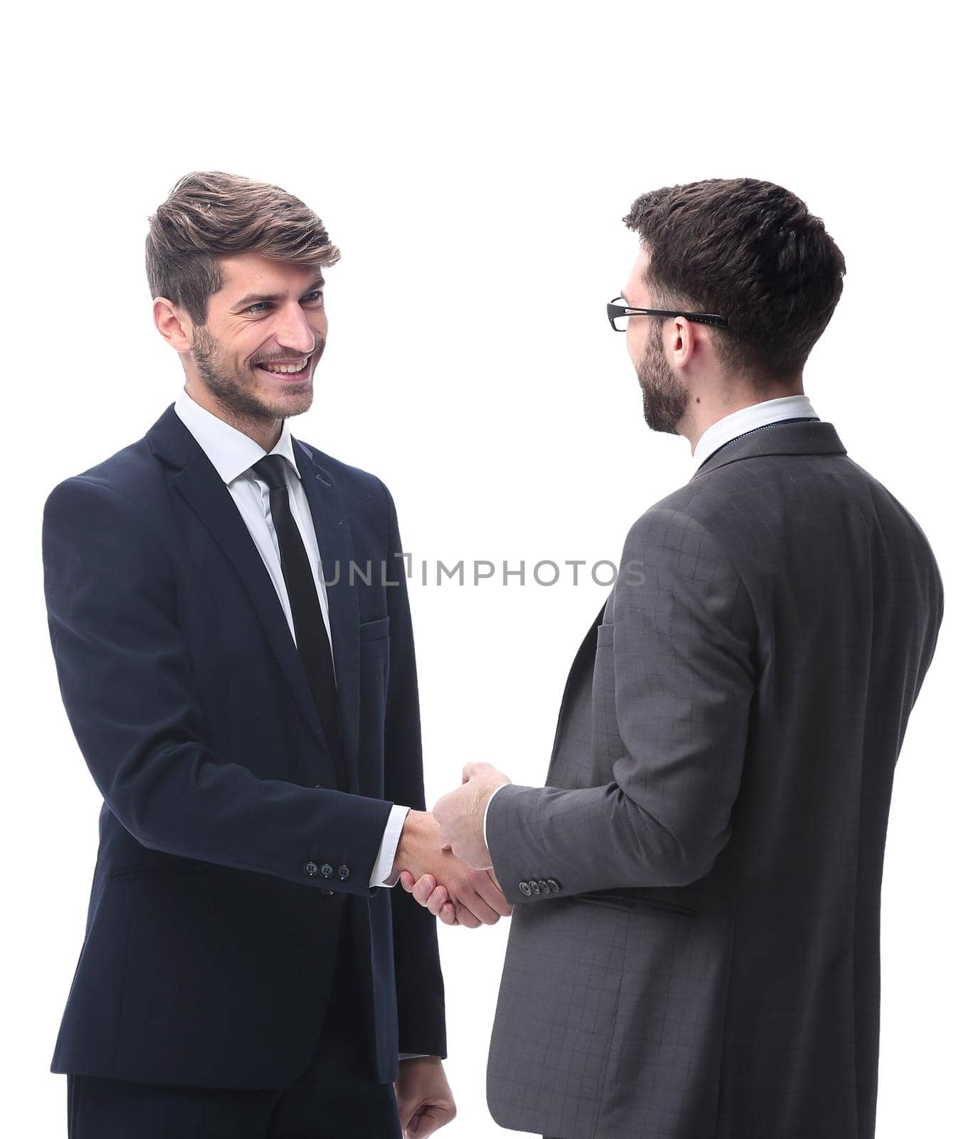 in full growth. two young businessmen discussing something. isolated on white background