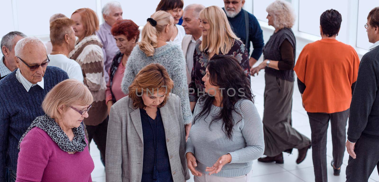 group of old people discussing indoors by asdf