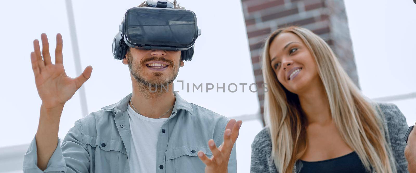 Multiethnic Business team using virtual reality headset in office meeting Developers meeting with virtual reality simulator in creative office.