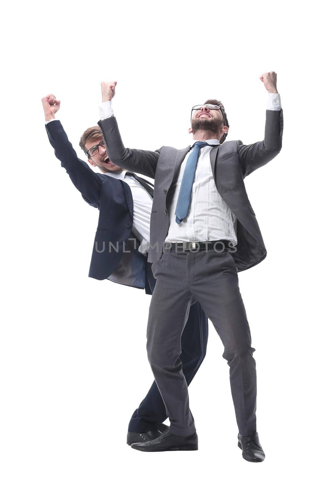 in full growth. two very happy young businessmen . isolated on white background.
