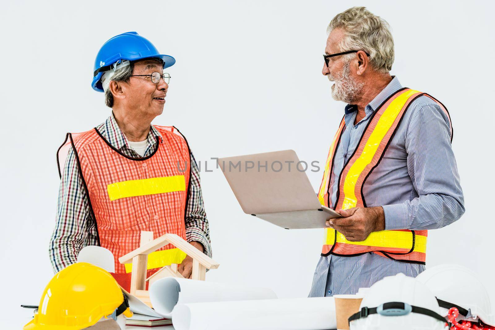 Senior engineers and architect working with construction plan. House building concept.