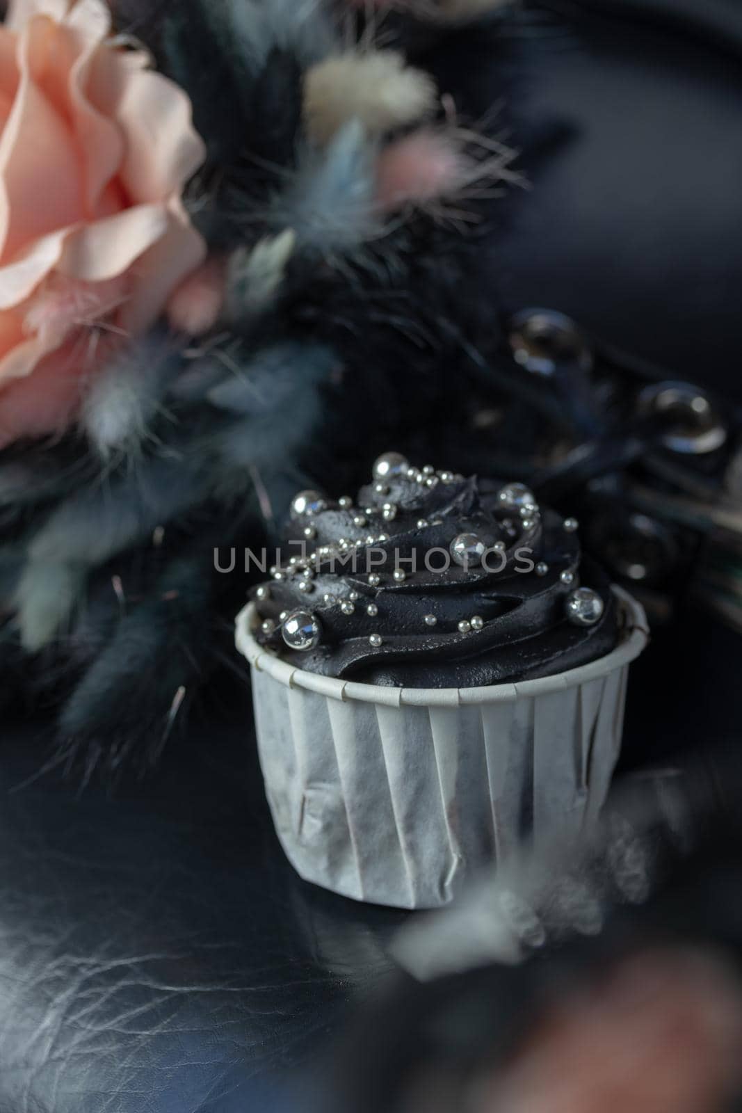 Grunge style cupcakes with black and pink cream vertical