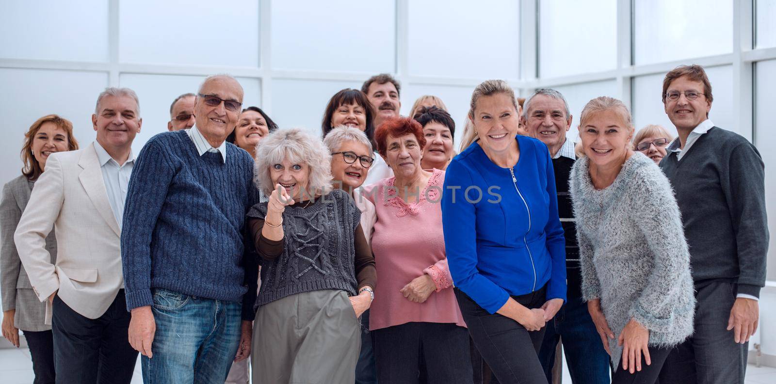 group of happy seniors look at camera by asdf