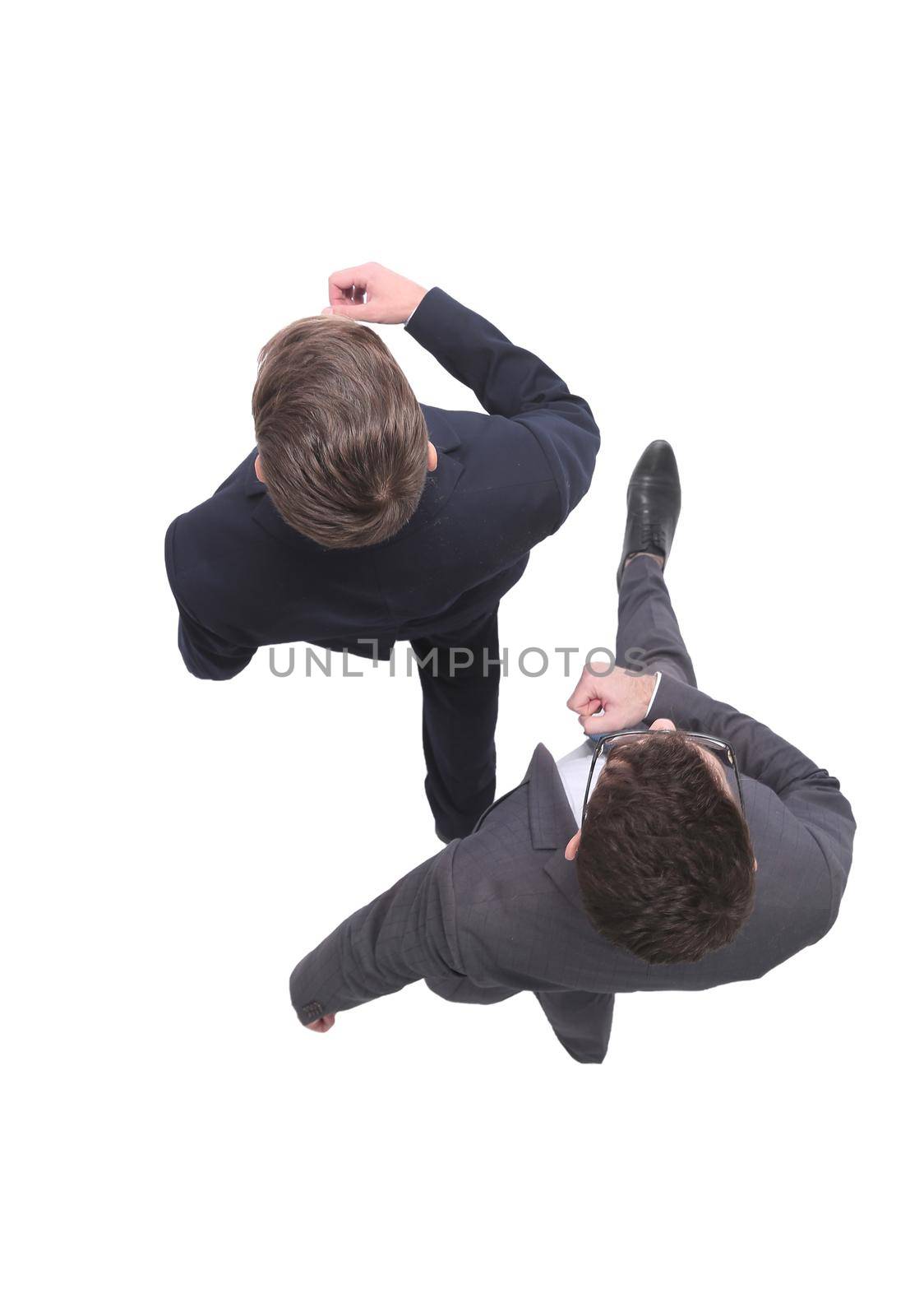 top view. two business people stepping forward. isolated on white background
