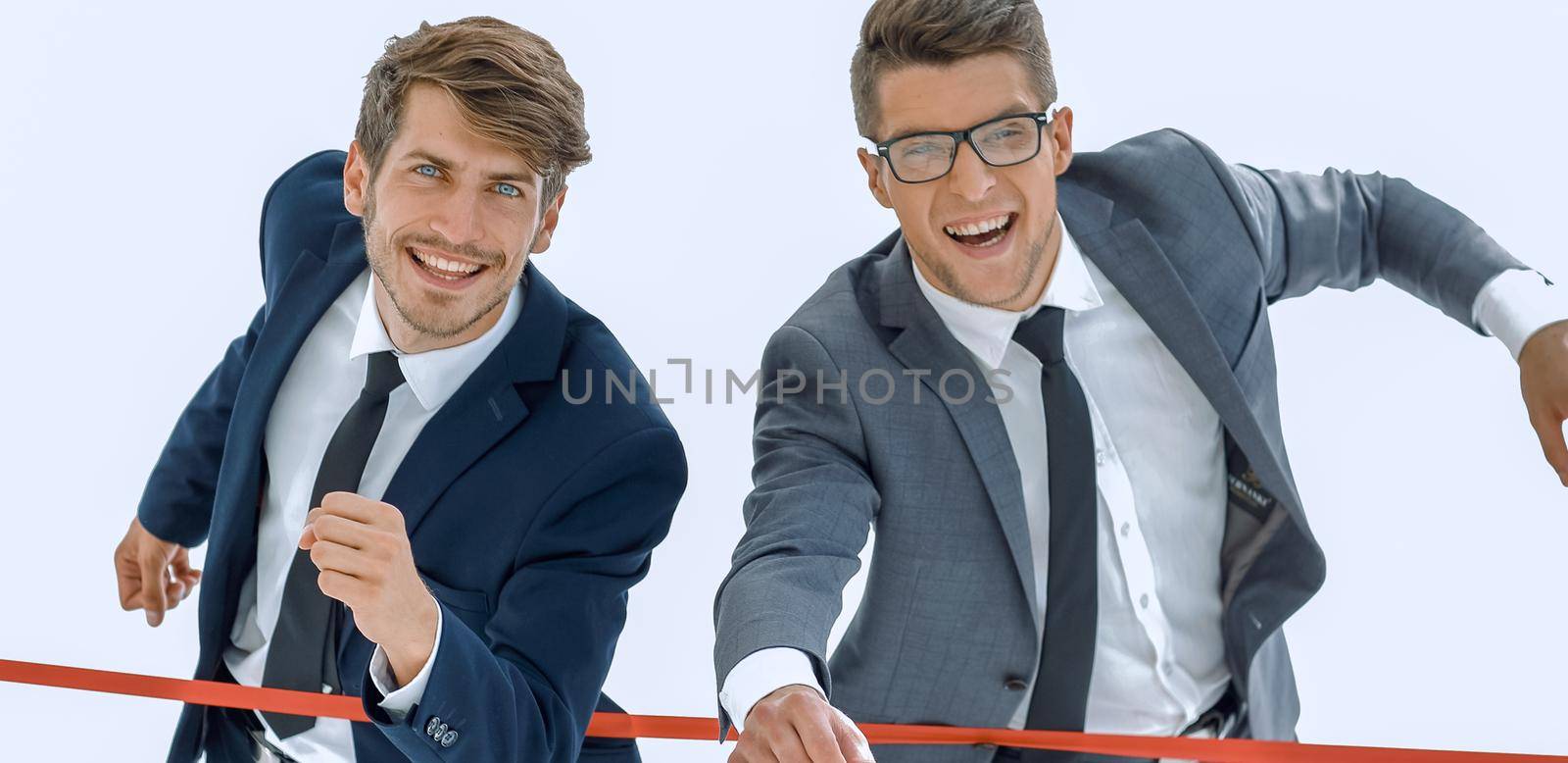 Photo of happy businessman crossing finish line during race