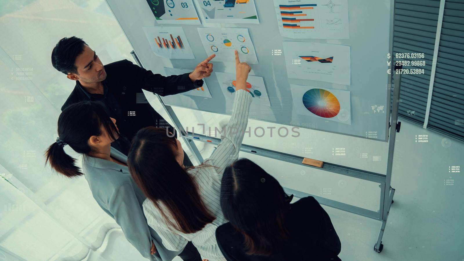 Business people in corporate staff meeting with envisional graphic . Concept of digital technology for marketing data analysis and investment decision making .