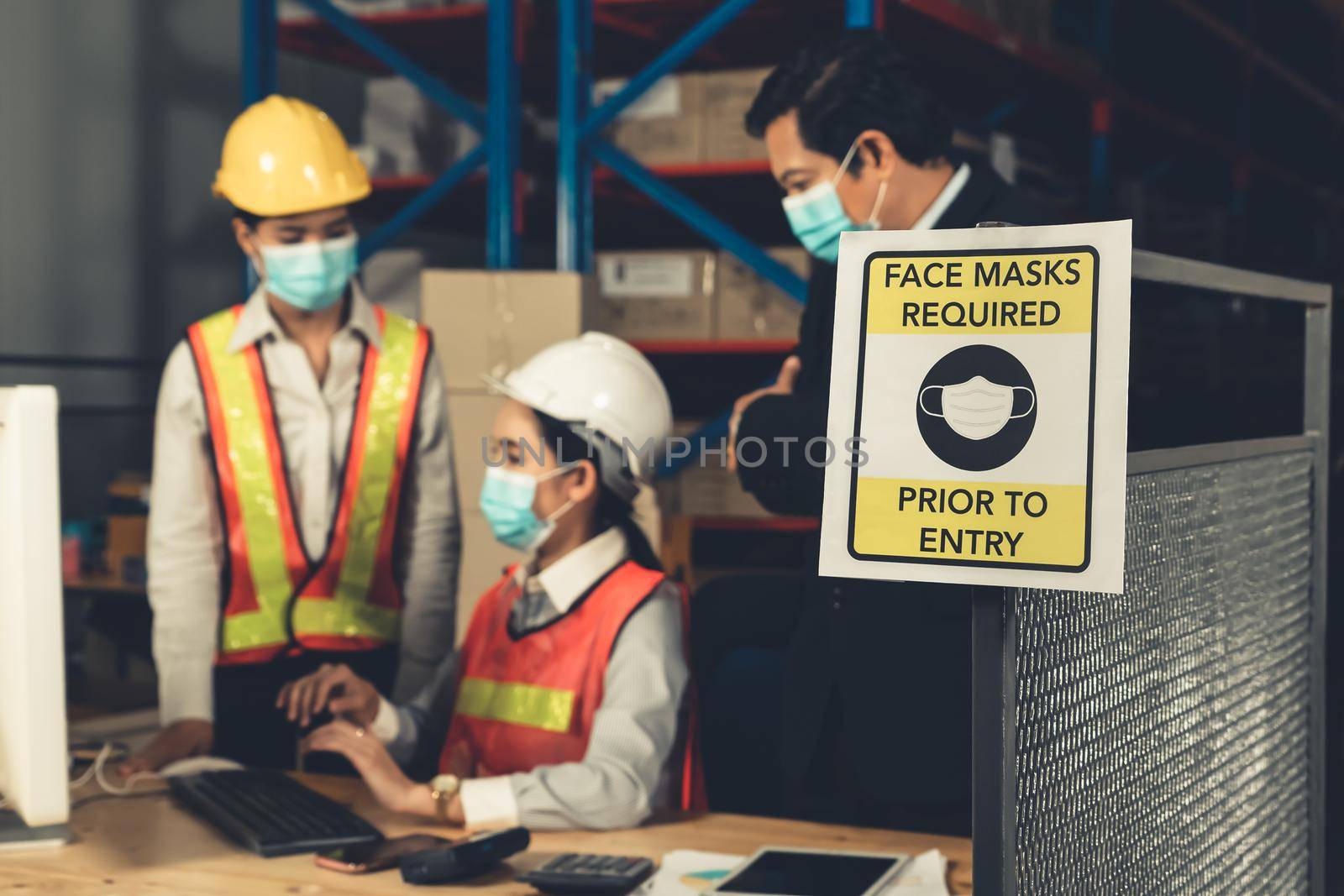 Caution sign in factory warning to industry labor worker to prevent Covid-19 Coronavirus spreading during job business reopening period after epidemic crisis . Working safely concept .