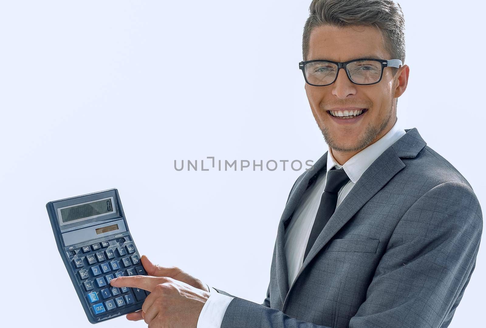Portrait of businessman show calculator on color background with copy space