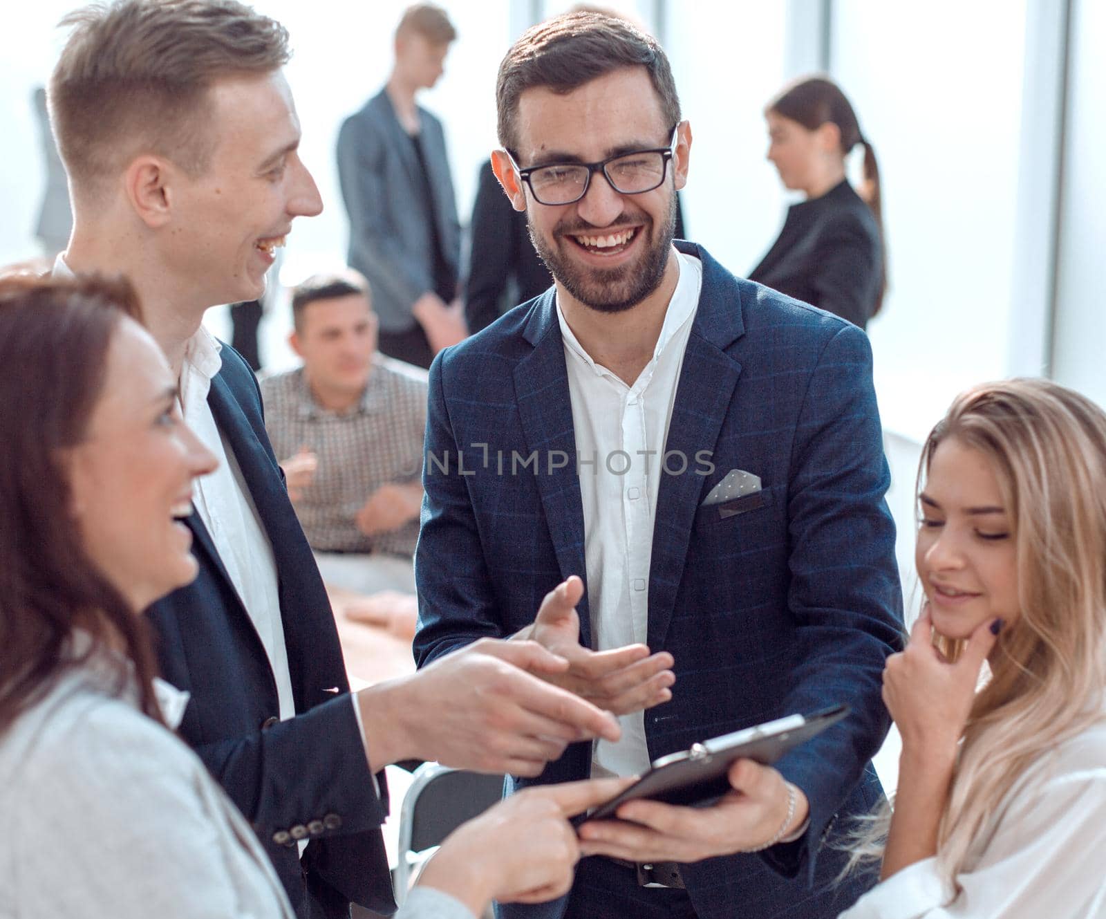 close up. young employees are discussing work issues. by asdf