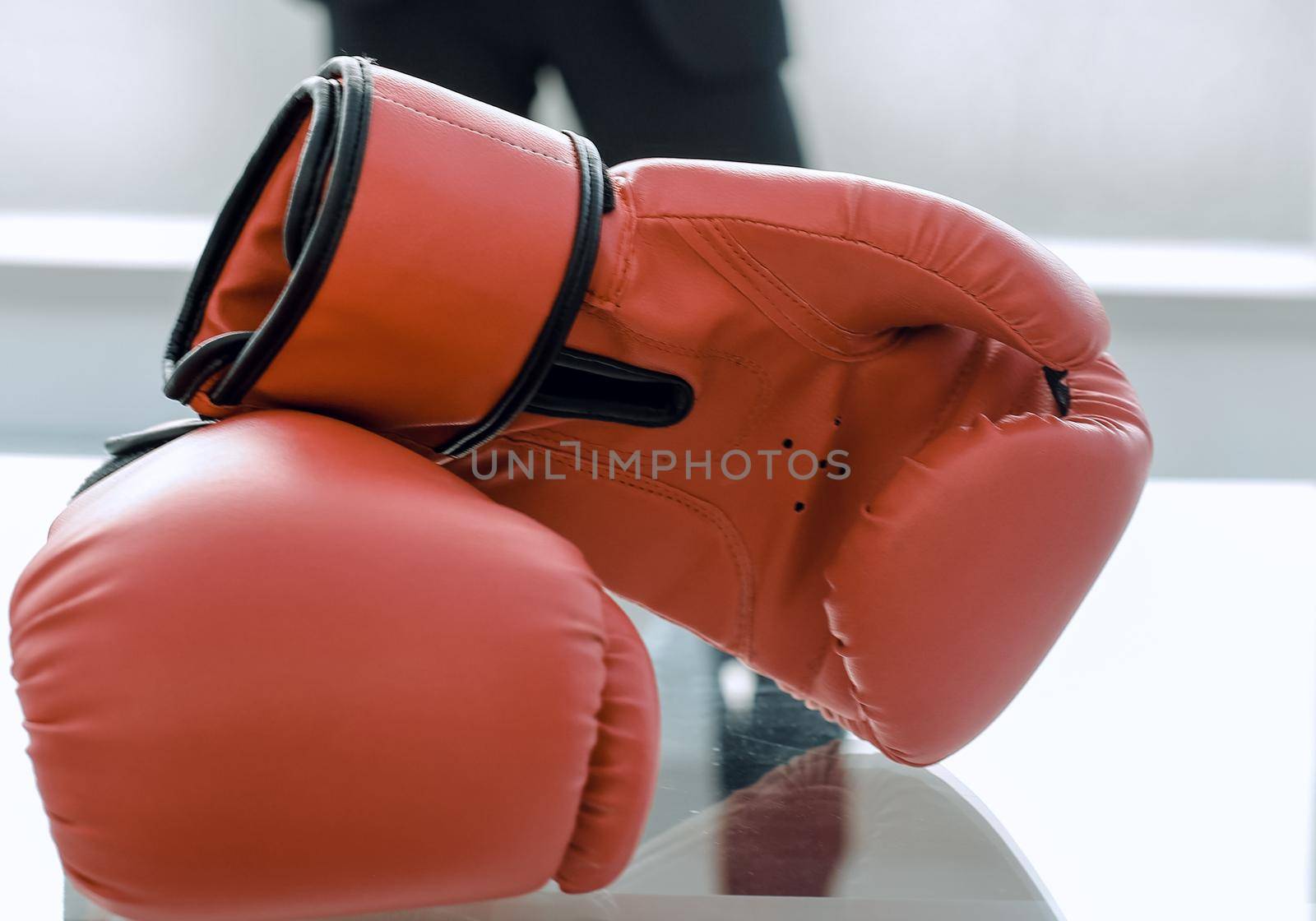 Boxing gloves on the businessman's desktop by asdf