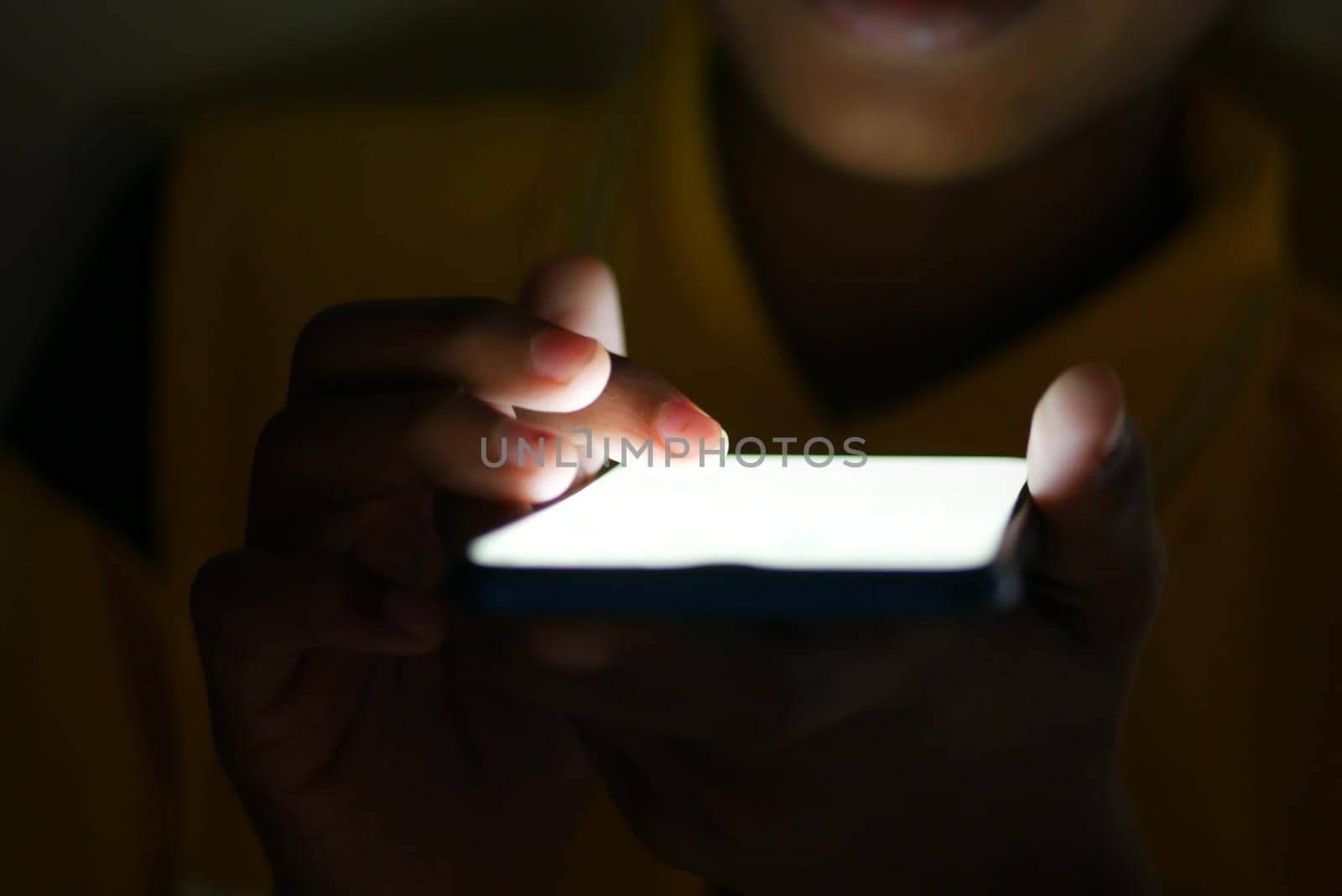 Close up of young man hand using smart phone