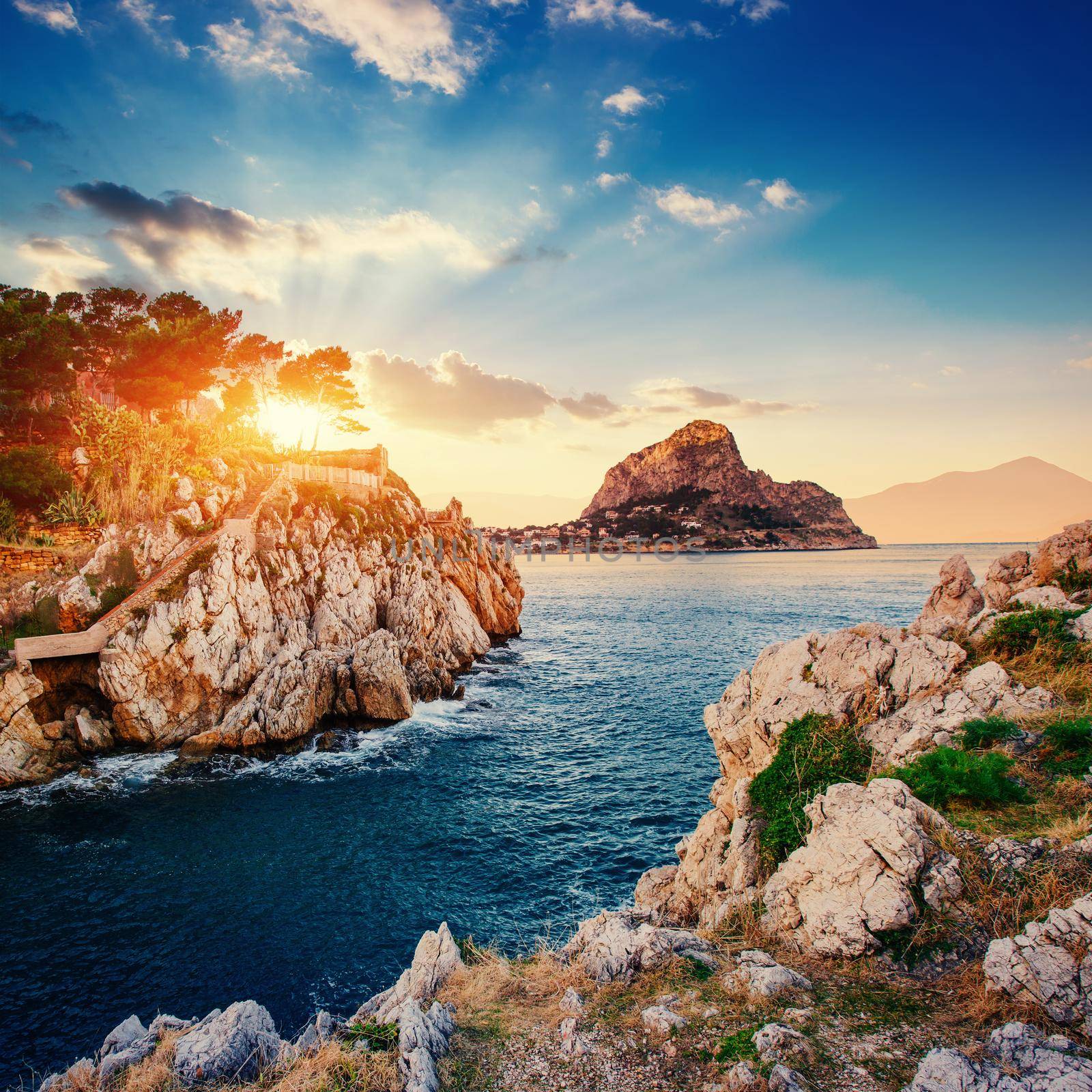 Fantastic view of the nature reserve Monte Cofano. Dramatic scene. Sunset over sea. Location cape San Vito. Sicilia, Italy, Europe. Mediterranean and Tyrrhenian sea.