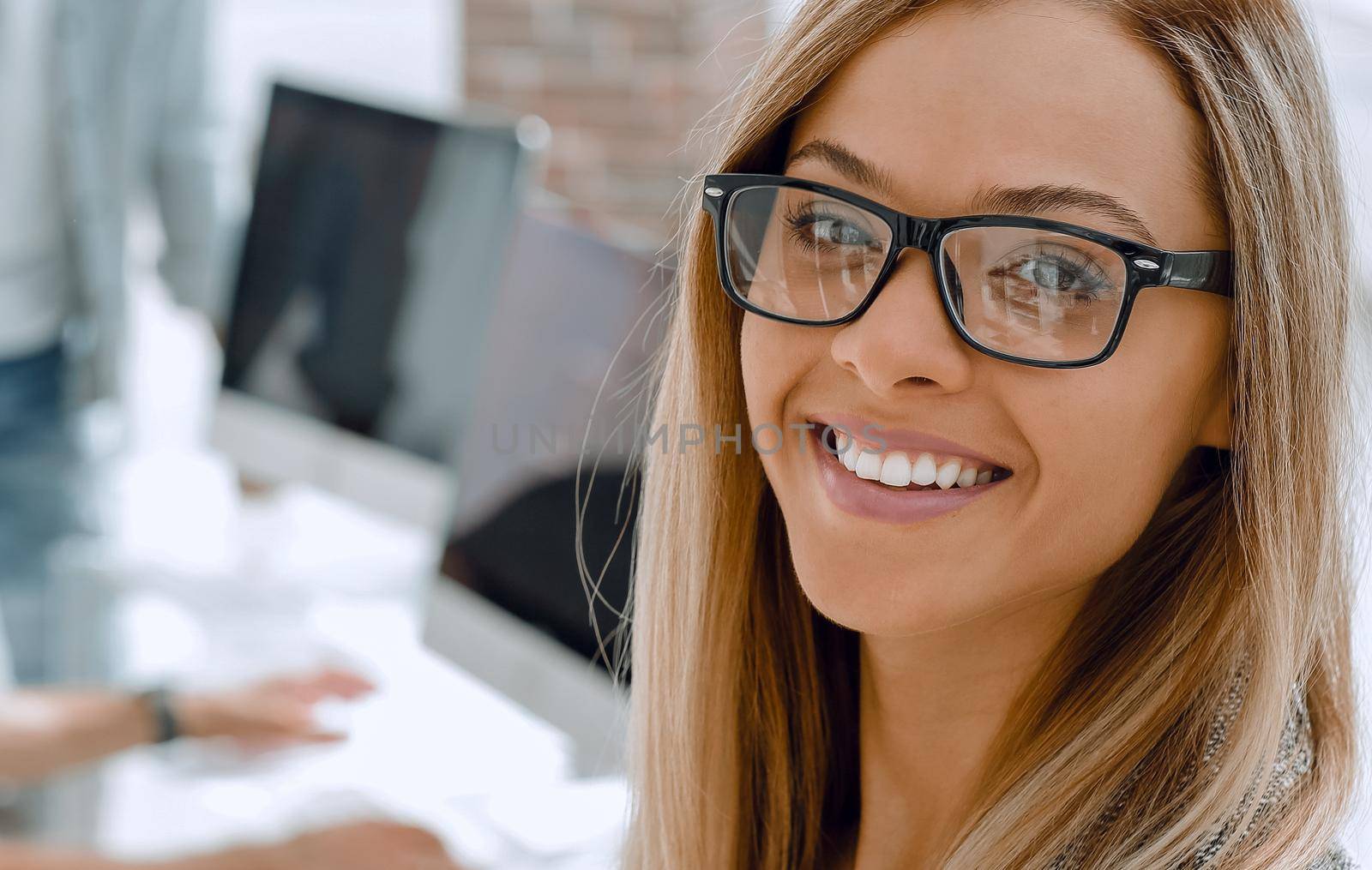 girl in the office. Colleagues on the background by asdf