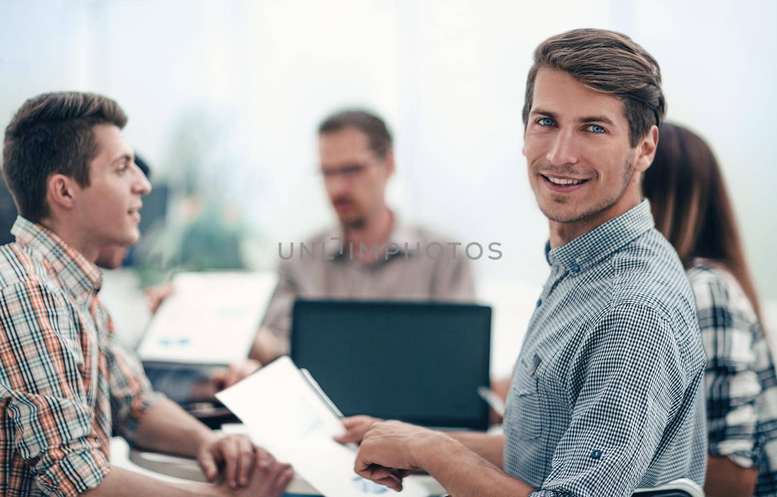 close up.successful employee sitting at the Desk.photo with copy space